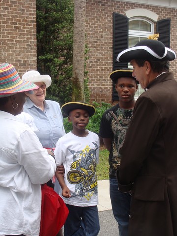 Re-enactor with Children.JPG